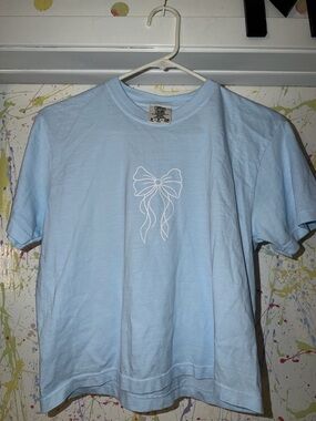 Light Blue Tee with White Bow Graphic